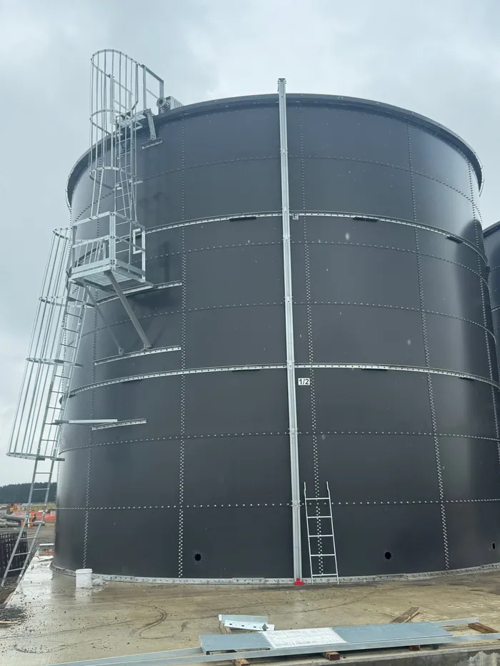 One of the finished tanks from the ground, with its access stair, caged ladder and roof platform