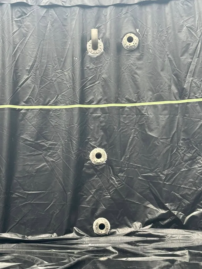Outlet and pipework fittings sealed through the new liner on the tank wall